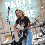 LAS VEGAS, NV - APRIL 01:  Musician Naomi Cooke of Runaway June performs onstage at the ACM Party For A Cause: Tailgate Party on April 1, 2017 in Las Vegas, Nevada.  (Photo by Rick Diamond/Getty Images for ACM)