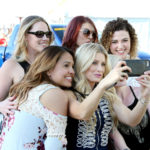 LAS VEGAS, NV - APRIL 01:  Guests take selfies at the ACM Party For A Cause: Tailgate Party on April 1, 2017 in Las Vegas, Nevada.  (Photo by Gabe Ginsberg/Getty Images for ACM)