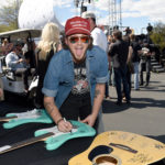 LAS VEGAS, NV - APRIL 01:  Singer Stephen Barker Liles signs a guitar at the ACM Party For A Cause: Tailgate Party on April 1, 2017 in Las Vegas, Nevada.  (Photo by Rick Diamond/Getty Images for ACM)