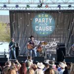 LAS VEGAS, NV - APRIL 01:  Singer Aaron Watson (C) performs onstage at the ACM Party For A Cause: Tailgate Party on April 1, 2017 in Las Vegas, Nevada.  (Photo by Gabe Ginsberg/Getty Images for ACM)